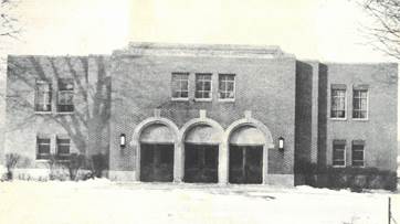 A building with arched doors

AI-generated content may be incorrect.