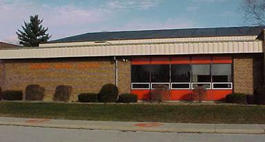 A building with a red roof

AI-generated content may be incorrect.